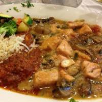 Salmon Scallopini · Salmon chunks sautéed in butter with garlic, mushrooms, tomatoes, marsella wine and touch of...