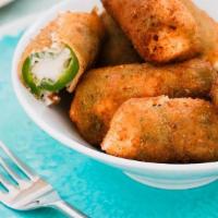 Jalapeno Poppers · Jalapeno poppers stuffed with cream cheese. Side of buttermilk ranch.
