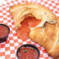 Calzone · Fried, stuffed pizza dough, mozzarella, ricotta, served with side of marinara. Choice of top...