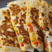 Quesadilla · Flour tortilla with cheese blend and your choice of chicken or carnitas.
