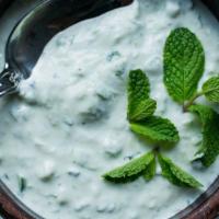 Must O'Khair · Yogurt with diced cucumber and dry mint.