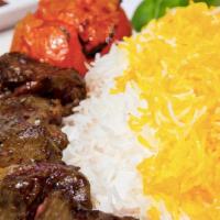 Shish Kabob · Served with grilled vegetables and broiled tomatoes and served with our special basmati rice...