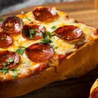 Pepperoni Cheesy Bread · Bread, topped with melted cheese, pepperoni, garlic & olive oil, herb seasoning, and baked t...