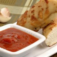 Perfect Bread With Marinara Sauce · Buttery delicious breadsticks baked to perfection. Served with a side of Marinara Sauce.