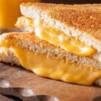 Grilled Cheese Sandwich · Bountiful brioche pain de mie with sharp cheddar, satisfying caramelized onions, perfectly s...