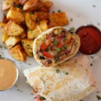 Breakfast Burrito · Scrambled eggs, crispy bacon, Mexican style black beans, Cheddar, pico de gallo and sour cre...