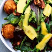 Goat Cheese Salad · Vegan. Fried Goat cheese, organic baby greens, fresh mango, fresh red beets and caramelized ...