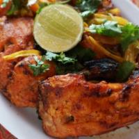 Chicken Tandoori · Spicy. Bone-in chicken marinated in yogurt and ground spices roasted in a clay tandoori oven...