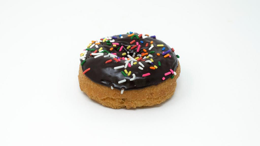 Rites Of Sprinkles (Chocolate Glaze) · A vanilla cake donut with chocolate glaze and rainbow sprinkles.