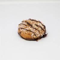 Angry Samoa · A vanilla cake donut dipped in chocolate and topped with caramel, toasted coconut, and choco...
