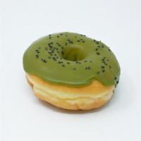 Green Teagan And Sara · A raised donut topped with a matcha tea glaze, toasted black sesame seeds, and a dash of fre...