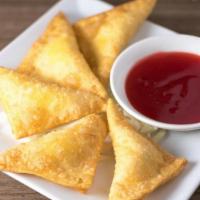 Crab 'N Cream Cheese Wontons · Served with house-made Sweet 'n Sour sauce.  6 pieces.