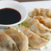 Pot Stickers · Chicken & Veggie Dumplings, served with house-made ginger soy dipping sauce. 7 pieces.