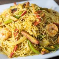 Singapore Noodles · Vermicelli Rice noodles, Shrimp and BBQ Pork stir-fried with flavorful curry spices with egg...