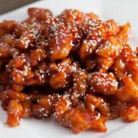 Sesame Chicken · Battered and fried chicken breast pieces, wok-tossed in a sweet and tangy glaze, then topped...