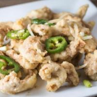 Salt 'N Pepper Chicken · Lightly battered and deep fried, then wok-baked with jalapenos and onions in a special blend...