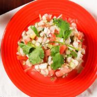 Ceviche Tower · Citrus marinated diced shrimp mixed with onions, tomatoes, cilantro, cucumber topped with av...