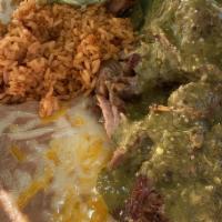 Carnitas Plate · Lean pork slow simmered with house spices until tender. Served a top of rajas.