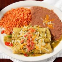 Enchiladas Flacas · Fresh spinach, grilled vegetables, rajas, cheese, pico de gallo and roasted tomatillo sauce.