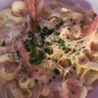 Chicken Fettuccine Alfredo · Homemade fettuccine in classic alfredo (butter, cream, and cheese) sauce topped with grilled...