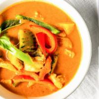 Pumpkin Curry · Red curry paste with choice of meat,  coconut milk, kabocha squash, bell pepper,  and Thai b...