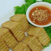 Fried Tofu · Deep fried crispy tofu served with sweet and sour sauce that contain cruch peanut on top.