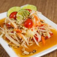 Thai Papaya Salad · Green papaya salad with dried shrimp, peanuts, green bean, tomato, chili, cabbage, and lime.