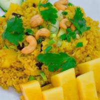 Pineapple Fried Rice · Jasmine rice stir fried with curry powder, pineapple chunks, egg, onion, raisins, cashew nut...