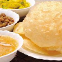 Halwa Puree  · Choley( Chickpeas) curry, Potato Curry and Sooji( Semolina) Halwa served with traditional st...