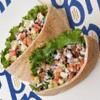 Kafta Kabob · Served on pita with tomato, onion, and lettuce. Comes with your choice of one side.