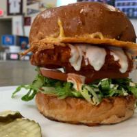 Buffalo Chicken Sandwich · Cheese Crusted Oil Top Bun, with buffalo chicken strips, lettuce, tomato and ranch dressing.
