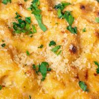 Mac &  Cheese · shell pasta smothered with our house-made cheese sauce baked with bread crumbs and parmesan ...