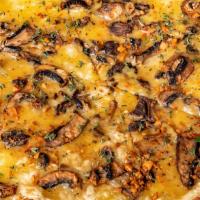 White  Mushroom · cream sauce, mozzarella, oven roasted crimini & oyster mushrooms, garlic chips, fresh thyme