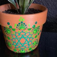 Heart Chakra Pot With Plant · Hand-painted mandala design Heart Chakra Pot includes a potted plant and incense stick.