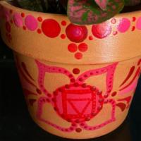 Root Chakra Pot With Plant · Hand-painted mandala design Root Chakra Pot includes a potted plant and incense stick.