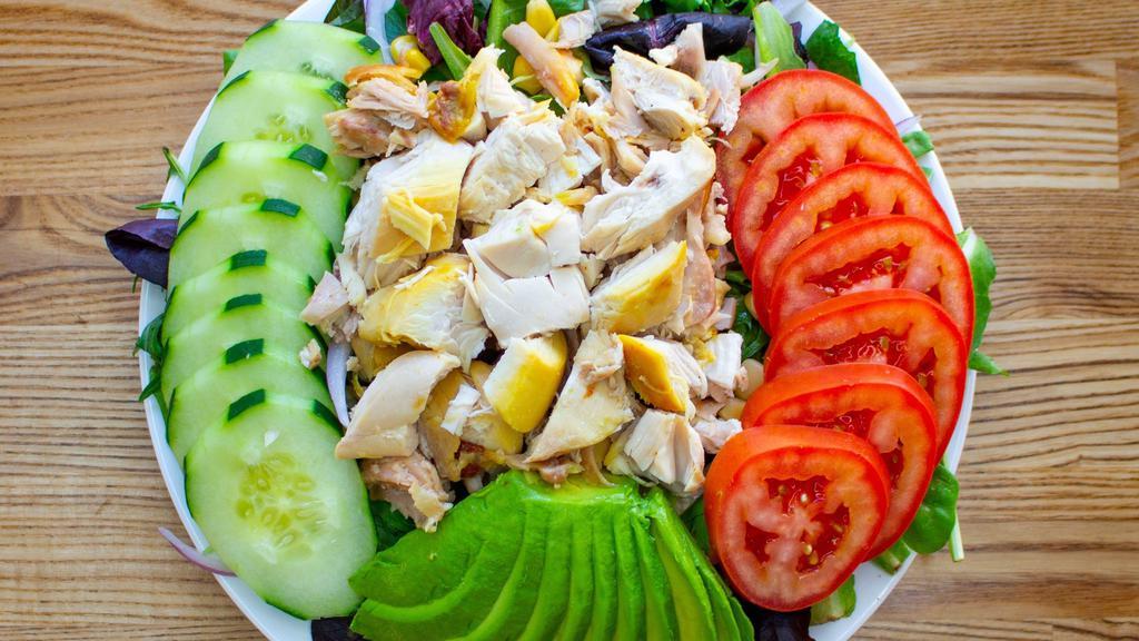 The Pollo Salad (With Avocado) · lettuce, spring mix, corn, red onion, tomato & cucumber topped with pollo & avocado (with sesame dressing)