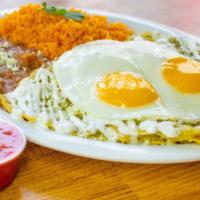 Chilaquiles · tortilla chips topped with salsa verde, onion, cheese, crema & 2 sunny-side eggs (with rice ...