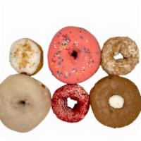 Baker'S Dozen · We will select a dozen of our freshest & most popular donuts available.