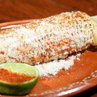 Elote Callejaro · Mayonnaise, queso cotija, chile powder, lime (roasted in corn husk)