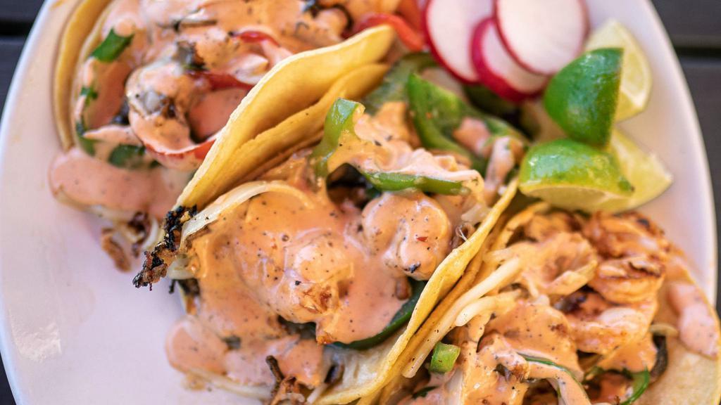 Tacos Gobernador · Grilled shrimp and Chando’s veggie mix, melted monterrey jack cheese and fresh made salsa. In crispy grilled handmade tortilla. Crispy and cheesy