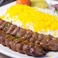 Ground Beef (Beef Koobideh) · Two skewered of charbroiled marinated ground beef served with broiled tomato, vegetables and...