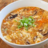 Surantan Ramen · Spicy. Hot and sour egg drop soup, sliced pork, shiitake mushroom, bamboo, carrot and green ...