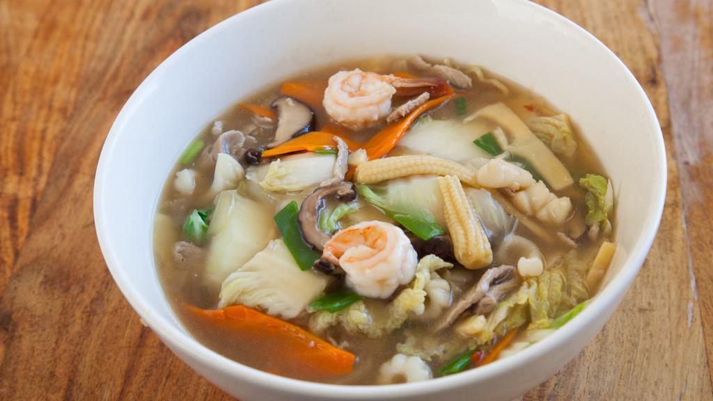 Sanmar Ramen · Light shoyu soup, sliced pork, shrimp, squid, Napa bamboo, carrot, green onion, baby corn and shitake mushroom.
