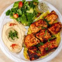 Chicken Kabab Plate · Cubes of chicken breast marinated overnight in our secret recipe and charbroiled on an open ...
