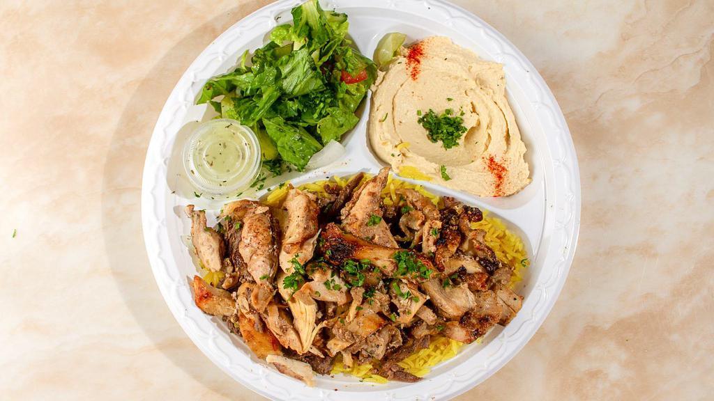 Chicken Shawarma Plate · Our marinated and flame-broiled chicken is always fresh, natural and hand-cut. Served with a side of garlic sauce.