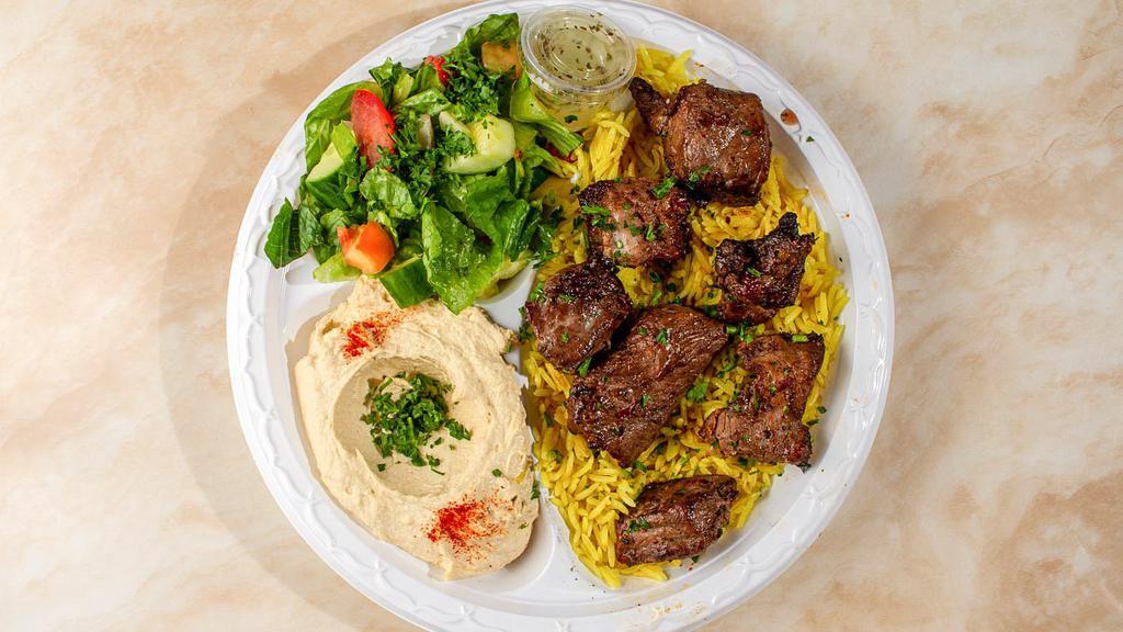 Beef Kabab Plate · Cubes of sirloin steaks marinated overnight in our special mix and charbroiled on an open fire to your desired doneness.