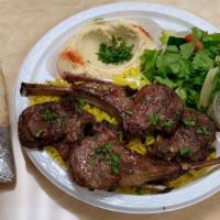 Lamb Chops Plate · 4 Pieces of Lamb Chops served with Humus, Salad, rice and a pita bread with some tahini sauce
