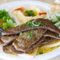 Gyro Plate · Thin slices of lamb and beef served with a side of tzatziki and gyro bread.