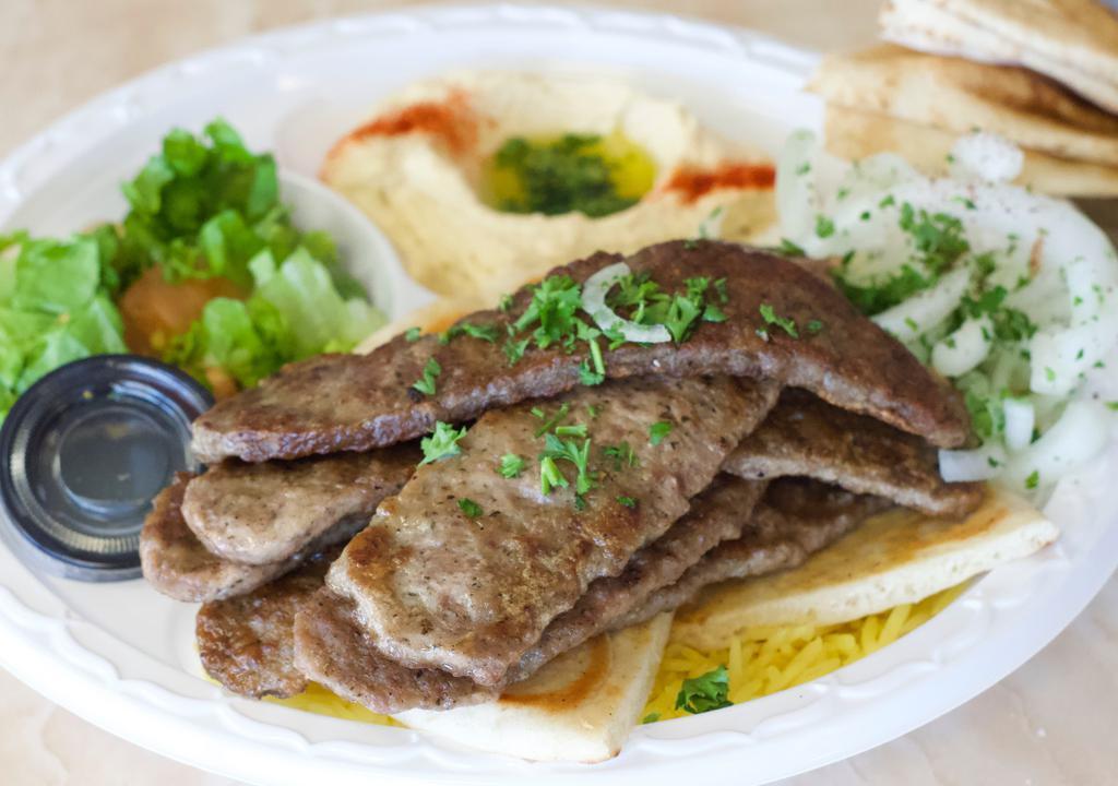 Gyro Plate · Thin slices of lamb and beef served with a side of tzatziki and gyro bread.