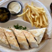 Pita Grill Shawarma- Chicken · Our Chicken Shawarma wrapped in a flat bread and toasted before cut in pieces, served with f...